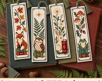 May include: Four rectangular cross-stitch bookmarks with green tassels, featuring embroidered designs of a fox on books, an owl with ferns, a rabbit with a book, and a frog on books with mushrooms. Finished size is 2.22 by 7.63 inches.