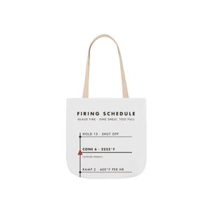 May include: A white tote bag with tan handles featuring a black graphic print titled FIRING SCHEDULE. The text includes GLAZE FIRE, ONE SHELF, TOO FULL, HOLD 15, SHUT OFF, CONE 6, 2232°F, (nobody sleeps), RAMP 2, and 400°F PER HR with a red triangle.