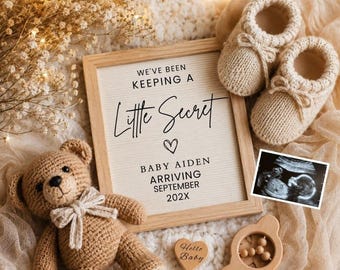 May include: A light wooden frame with the text WE'VE BEEN KEEPING A Little Secret, a heart icon, BABY AIDEN ARRIVING SEPTEMBER 202X, a pair of beige knit baby booties, a brown crochet teddy bear, a small wooden heart, and a baby ultrasound scan.