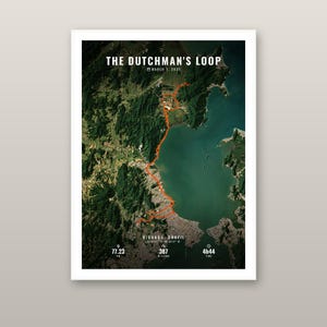May include: A rectangular map print titled THE DUTCHMAN'S LOOP, dated MARCH 1, 2025. It features a satellite view of Biguaçu, Brazil, with an orange route line, coordinates, 77.23 KM distance, 387 M climb, and 4h44 time displayed in white text.