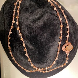 Crochet necklace made with cotton and viscose yarn.