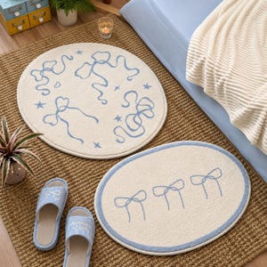 Grazioso tappeto a forma di fiocco, morbido e soffice, rotondo o ovale, per camera da letto, antiscivolo, ideale come tappetino da comodino, tappeto estetico per la cameretta, soggiorno o per la decorazione della casa, perfetto come regalo.