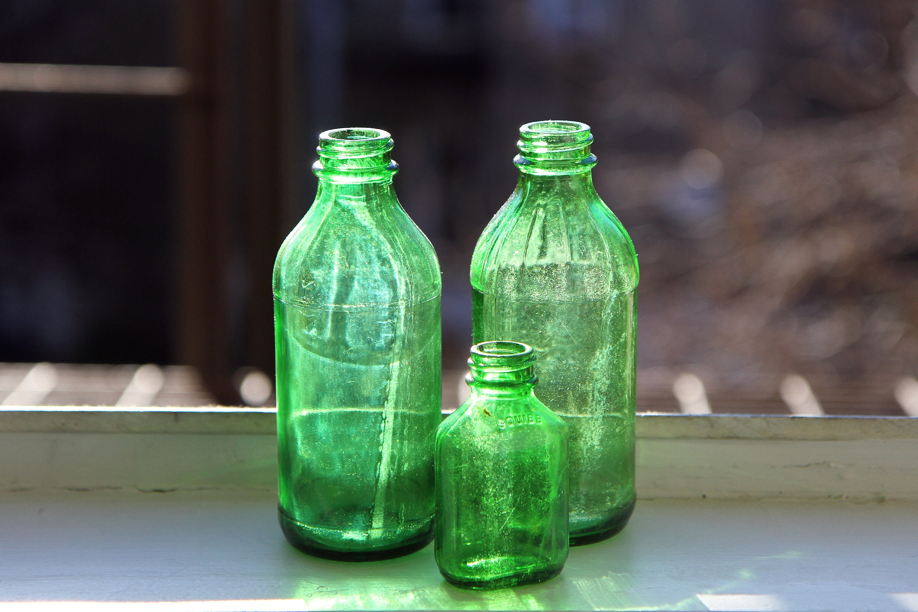 Botella de vidrio verde base redonda 500 cc - Reachem