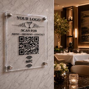 May include: A rectangular clear acrylic sign mounted on a marble wall with four silver standoffs. The sign features black text reading YOUR LOGO, SCAN FOR MENU, REVIEWS, CONTACT, a martini glass icon, a large QR code, and an NFC symbol at the bottom.
