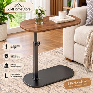 May include: A C-shaped side table with a dark wood-grain oval top and a black metal base. The table features an adjustable height mechanism with a knob on the central support column. Text on the image includes SJMHomeStore, Adjustable Height, Sturdy Metal Frame, Strong Load Capacity, and Space Saving C Shape Design.