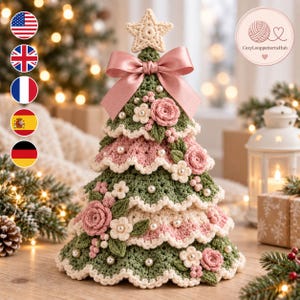 May include: A tiered crochet Christmas tree in sage green and soft pink, topped with a cream star. The tree is decorated with crocheted roses, small white flowers, and scattered white pearls, finished with a large satin pink bow at the top.