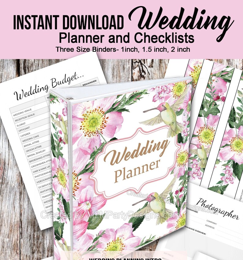 May include: A pink and green floral wedding planner binder with a hummingbird on the cover. The text "Wedding Planner" is in gold lettering on a pink background. The binder is available in three sizes: 1 inch, 1.5 inches, and 2 inches.