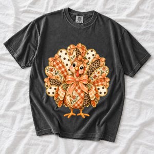 Turkey with patchwork fabric tail feathers decorated with bows on a cream and polka-dot stripe background