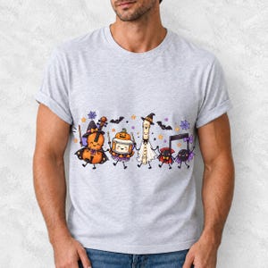 Kawaii violin, drum, recorder and notes with faces in Halloween costumes, pastel purple and orange