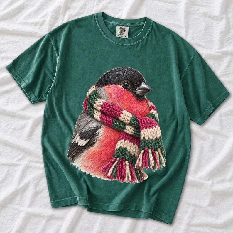 Colored-pencil bullfinch bird wrapped in a chunky striped knit scarf, cozy winter birdwatcher t-shirt art