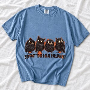 Four fluffy big-eyed black owls in a row with the text "Support Your Local Parliament"