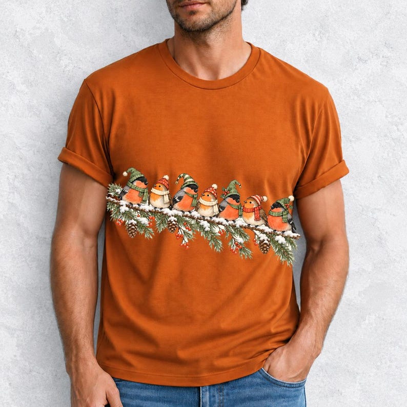 Watercolor bullfinches and robins in elf hats and scarves on a snowy pine branch