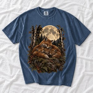 Fox family curled on a rock under a huge full moon among birch trees, dark realistic woodland illustration