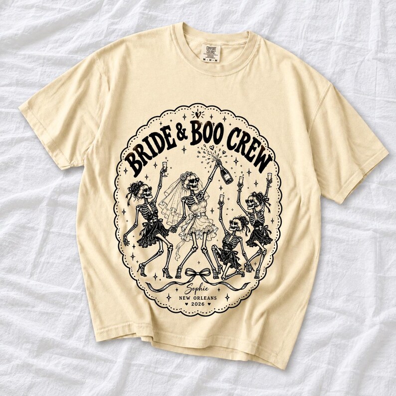 Skeleton bride popping champagne with cheering skeleton bridesmaids and the text Bride & Boo Crew
