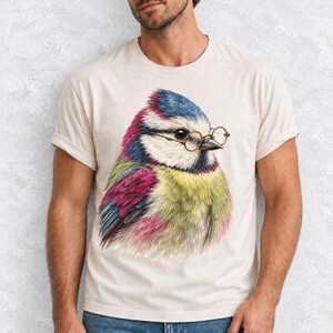 Colored-pencil blue tit bird wearing tiny round reading glasses, funny birdwatcher t-shirt illustration