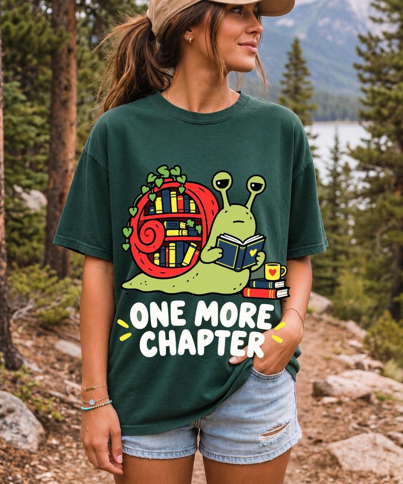 Cartoon snail reading a book with a bookshelf shell and the text One More Chapter