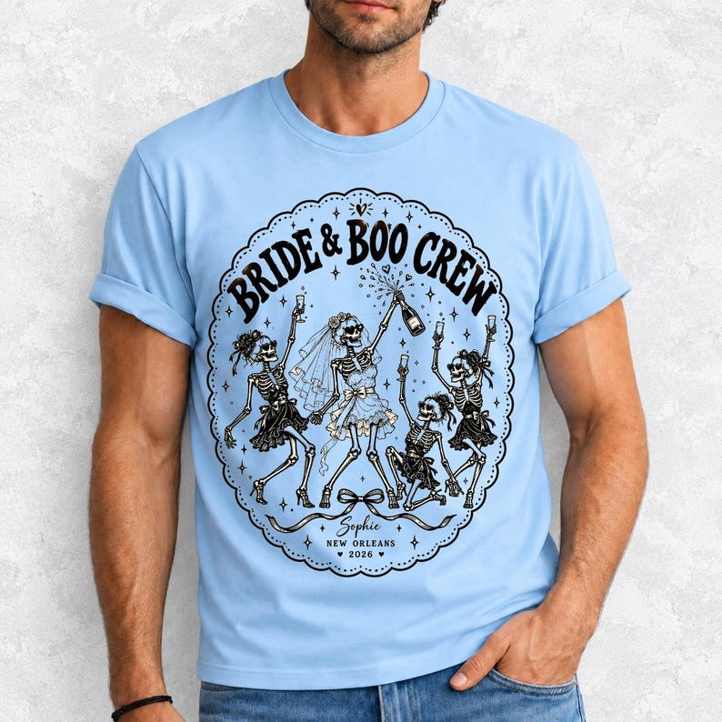 Skeleton bride popping champagne with cheering skeleton bridesmaids and the text Bride & Boo Crew