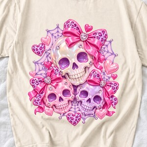 Puffy glossy 3D pink skulls with bows, hearts, cobwebs and rhinestones in coquette style