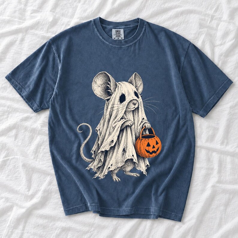 Etched pen illustration of a small mouse in a sheet ghost costume holding a candy bucket, bone white with orange accent