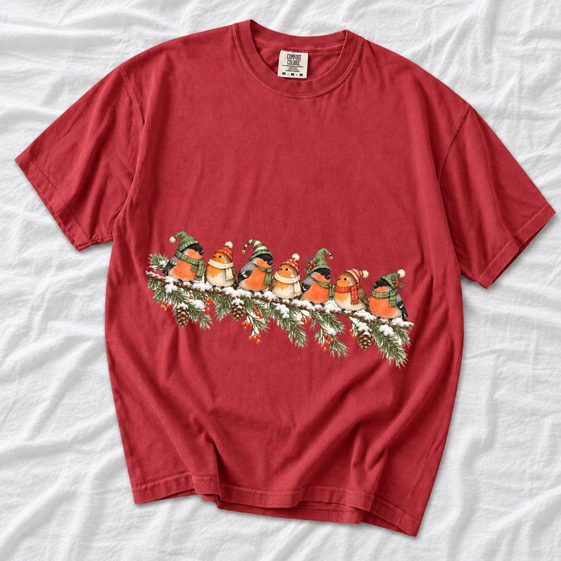 Watercolor bullfinches and robins in elf hats and scarves on a snowy pine branch