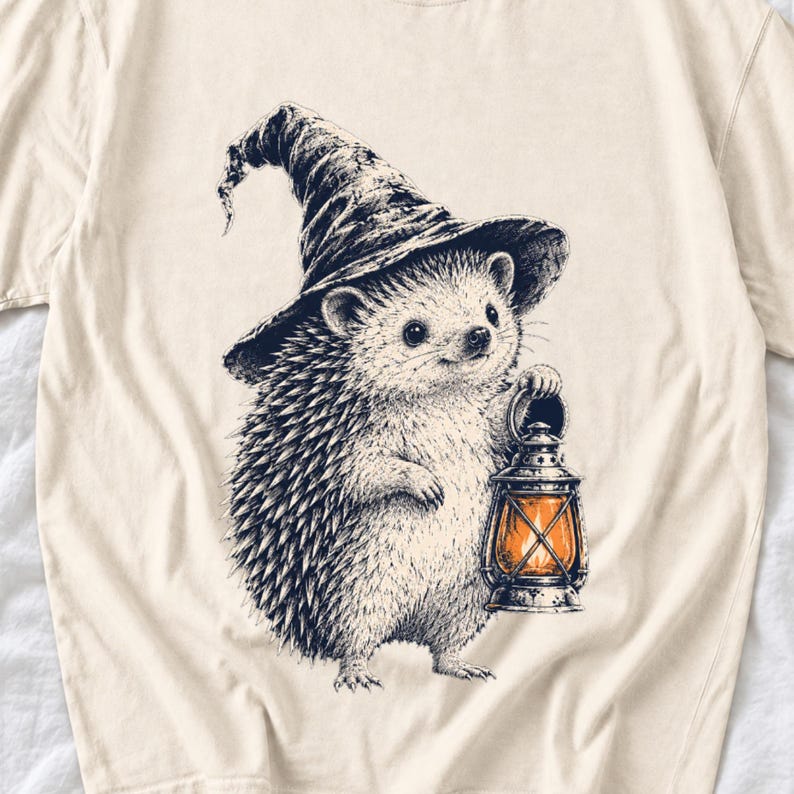 Etched pen illustration of a hedgehog in a witch hat holding a lantern, bone white with orange accent