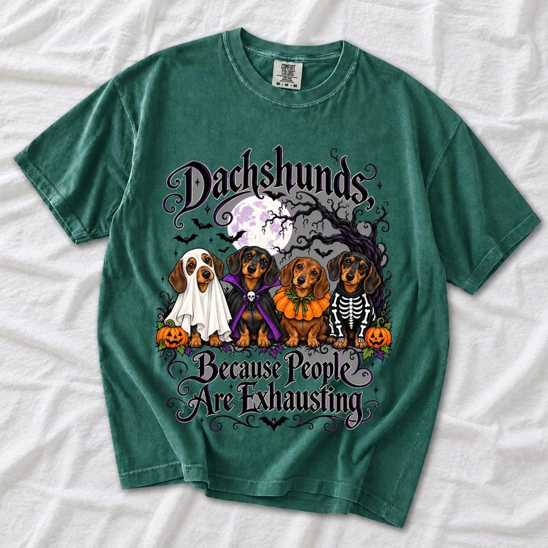 Four dachshunds in Halloween costumes under a spooky tree with text Dachshunds, Because People Are Exhausting