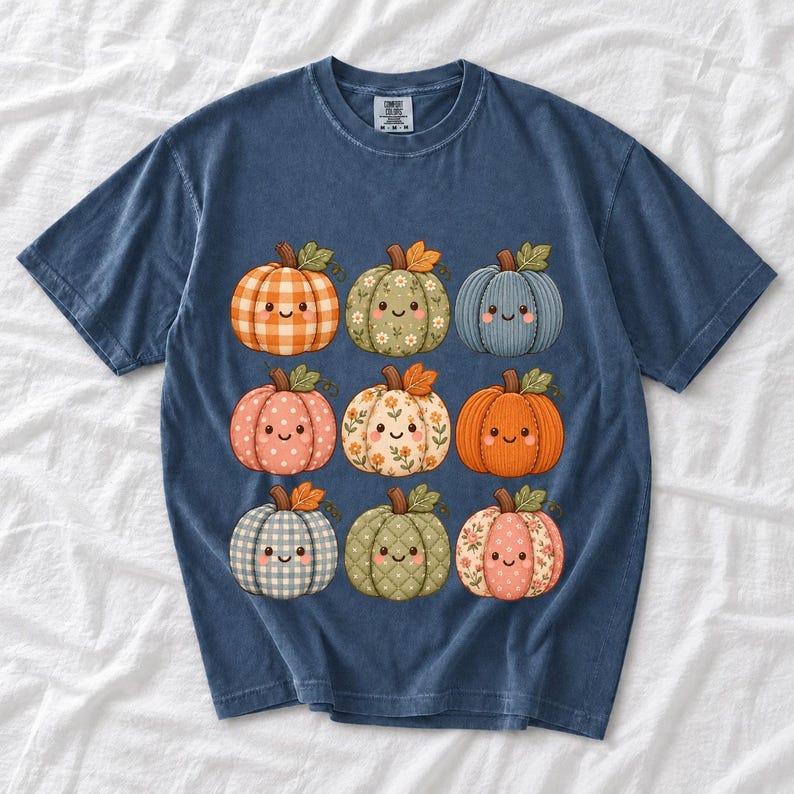 Grid of smiling pumpkins sewn from gingham, floral and corduroy patchwork fabric in autumn colors