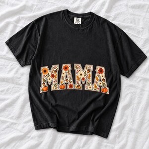 Arched varsity word MAMA filled with fall flowers and acorns in cream, rust and mustard