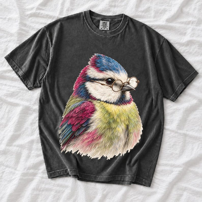 Colored-pencil blue tit bird wearing tiny round reading glasses, funny birdwatcher t-shirt illustration