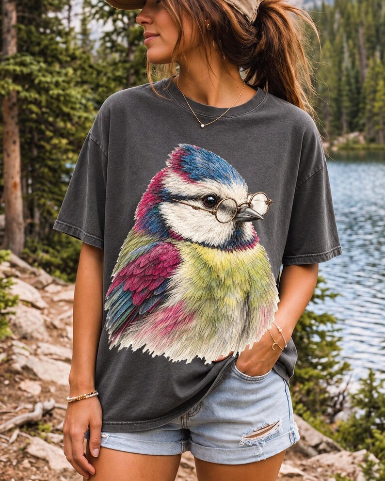 Colored-pencil blue tit bird wearing tiny round reading glasses, funny birdwatcher t-shirt illustration