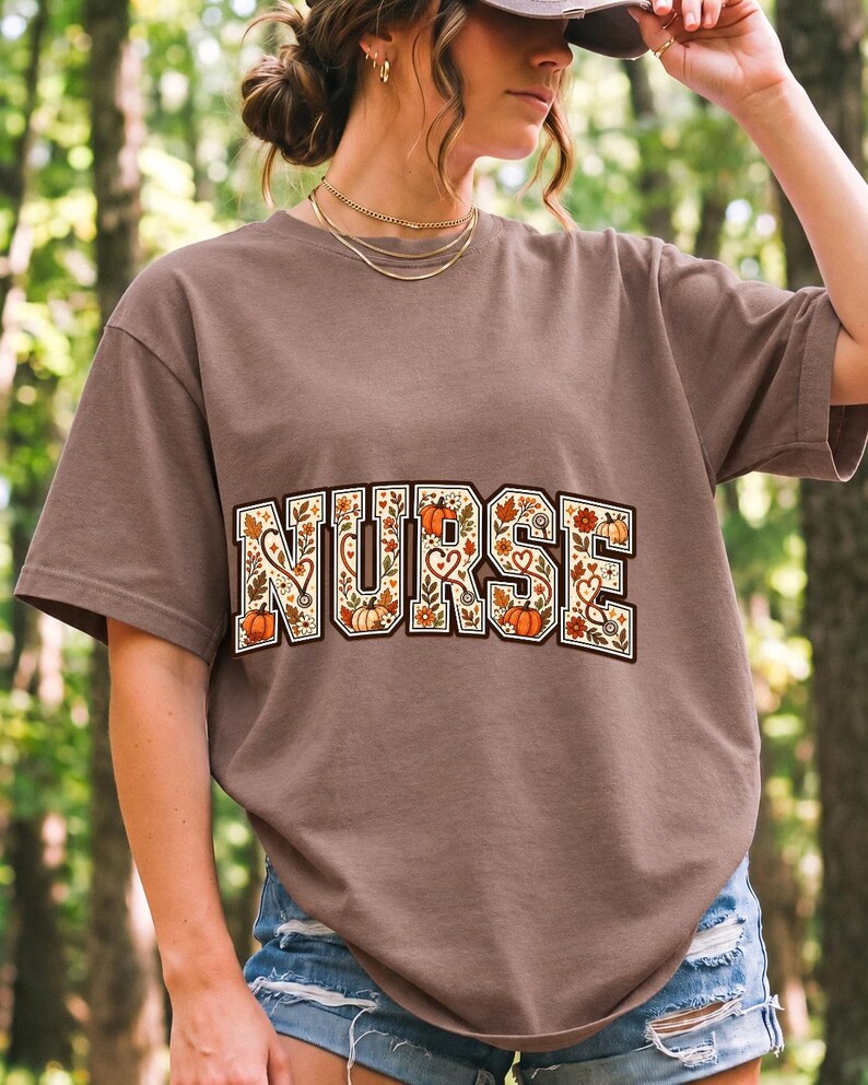 Arched varsity word NURSE filled with autumn leaves, stethoscopes and pumpkins in cream, rust and mustard