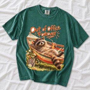 Raccoon relaxing in a hammock with a soda can and sunglasses, 90s film photo style, text "Out of Office Forever"