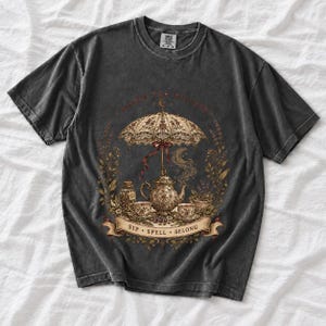 Vintage poster style ornate teapot with crescent moon steam, teacups and herbs, text Coven Tea Society