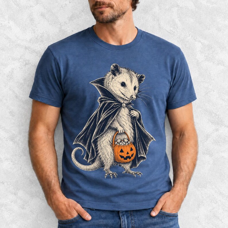 Etched pen illustration of an opossum in a vampire cape holding a candy pumpkin, bone white with orange accent