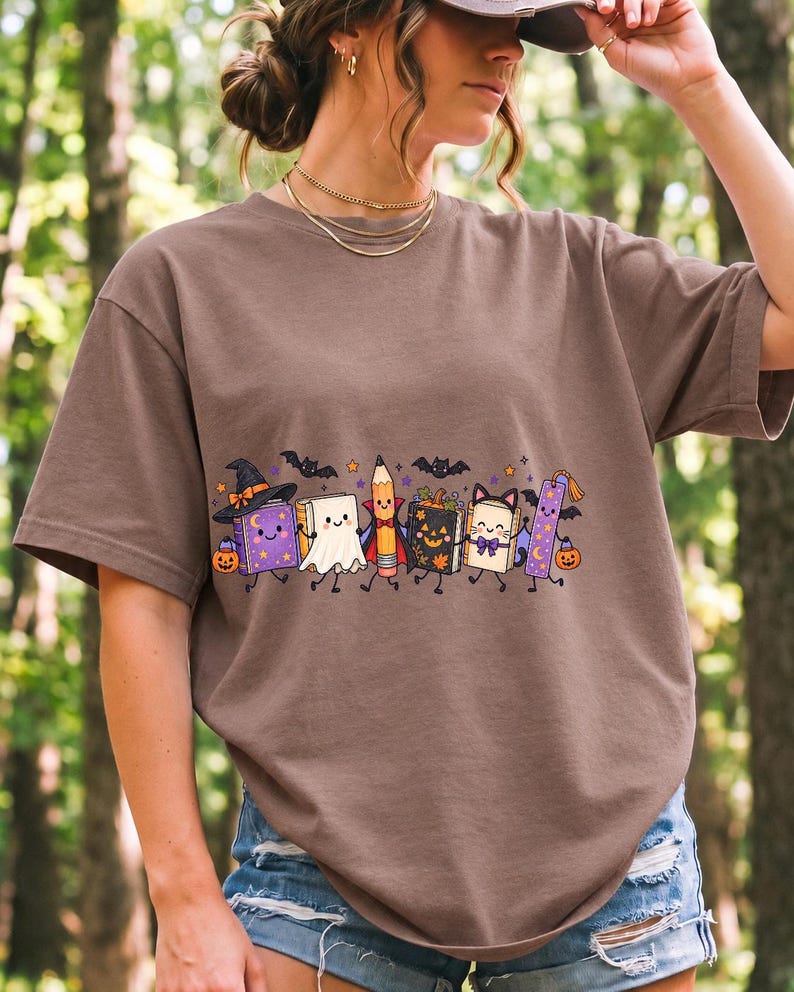Kawaii books, pencil and bookmark with faces in Halloween costumes, pastel purple and orange