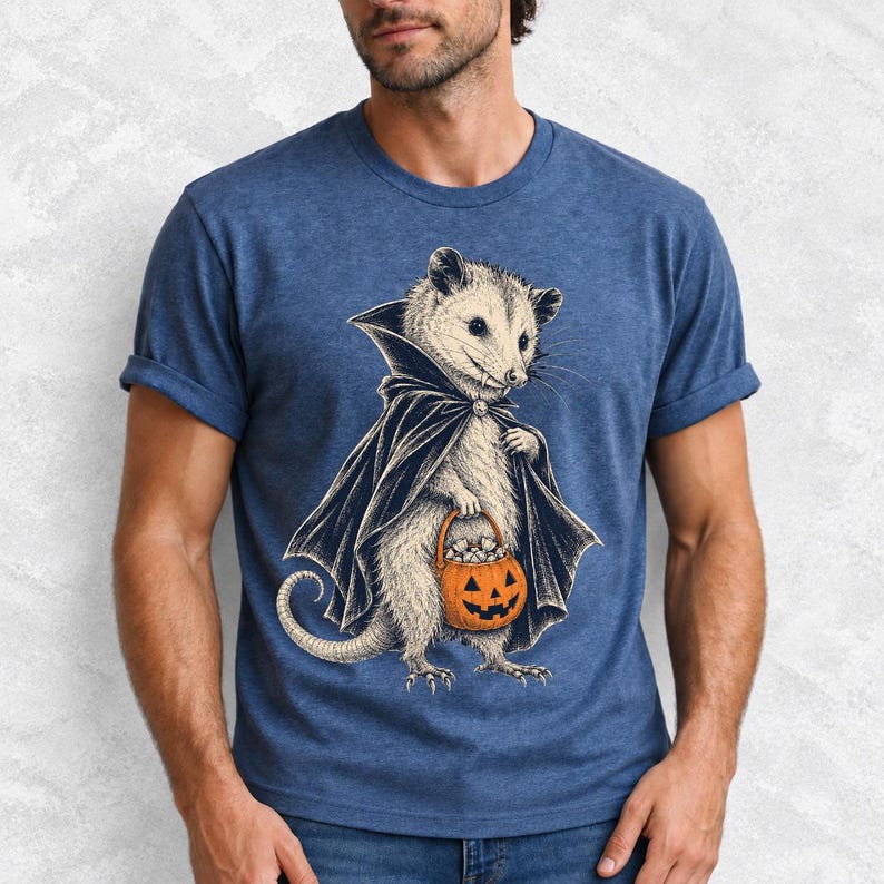 Etched pen illustration of an opossum in a vampire cape holding a candy pumpkin, bone white with orange accent