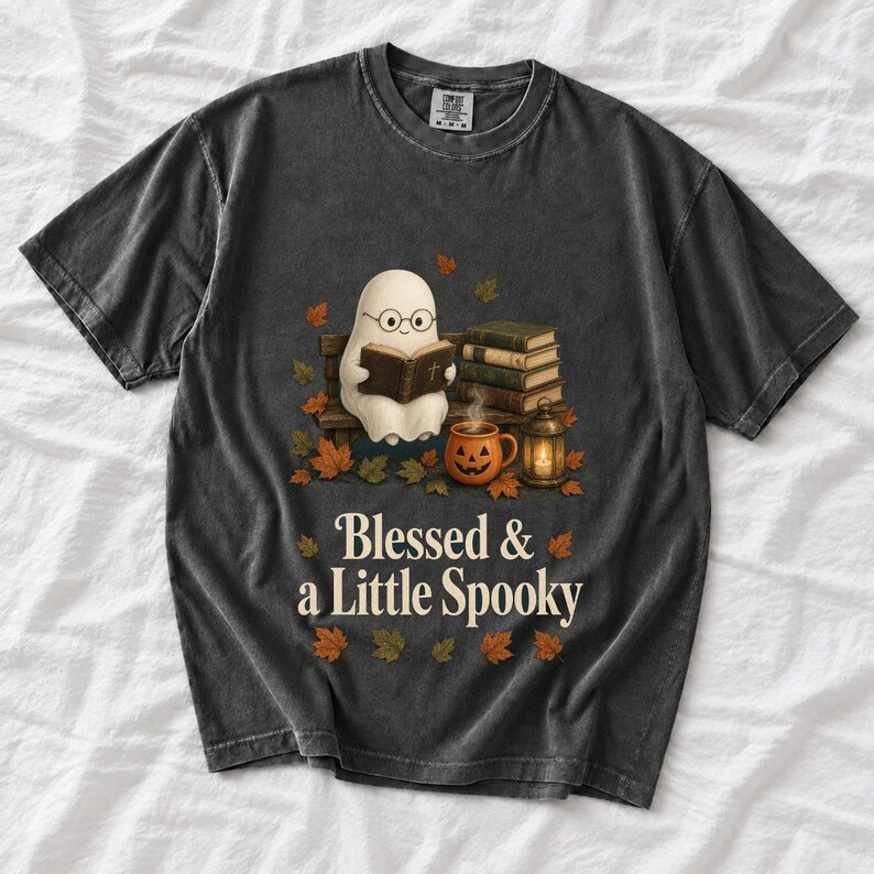 Cute ghost with glasses reading a Bible with a candle and mug, text "Blessed & a Little Spooky", retro fall illustration