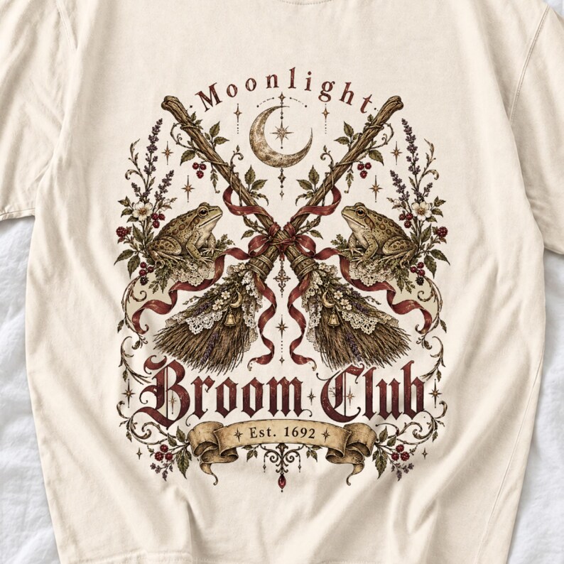 Vintage poster style crossed broomsticks with ribbons, lace and toads, text Moonlight Broom Club Est. 1692