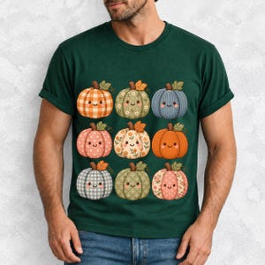 Grid of smiling pumpkins sewn from gingham, floral and corduroy patchwork fabric in autumn colors