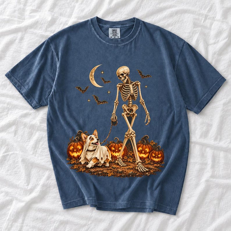 A skeleton walking a corgi in a ghost costume past carved pumpkins under a crescent moon