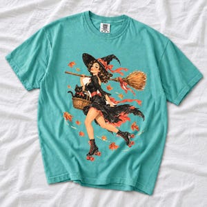 Retro 1950s pin-up witch on roller skates with a broom and a cat in a basket, autumn leaves