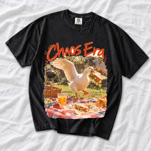 Goose stealing a sandwich from a picnic blanket, 90s film photo style, text "Chaos Era"