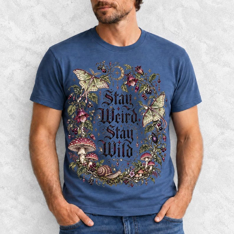 Victorian-style wreath of nightshade, luna moths and toadstools around the words "Stay Weird, Stay Wild"