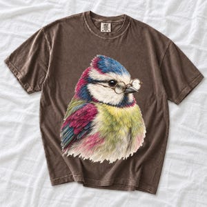 Colored-pencil blue tit bird wearing tiny round reading glasses, funny birdwatcher t-shirt illustration