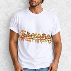 Row of watercolor sparrows on a branch holding tiny apples, corn and a pumpkin for harvest