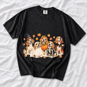 Five watercolor beagles in witch, ghost, pumpkin, skeleton and vampire costumes with floating autumn leaves