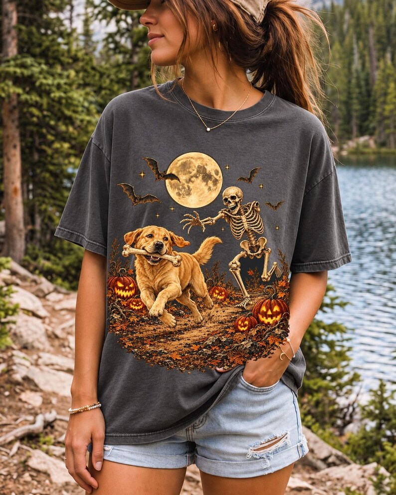 A skeleton chasing a golden labrador that stole its arm bone under a full moon with jack o lanterns and bats