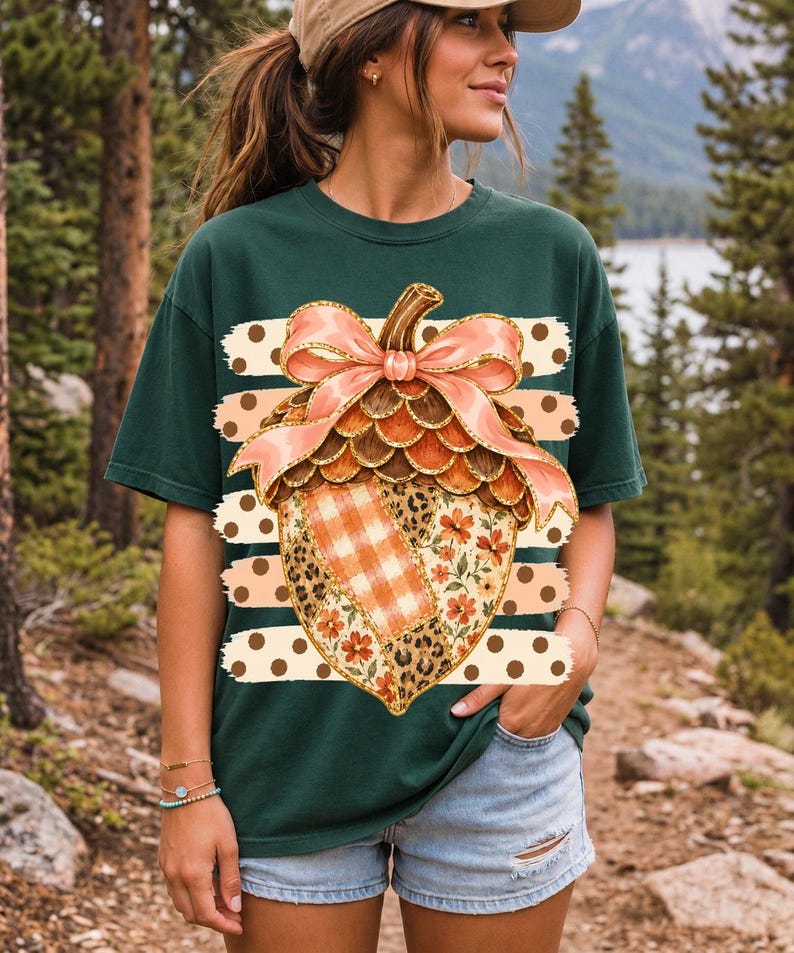 Giant patchwork acorn with a pink satin bow made of plaid, leopard and floral fabric on polka-dot stripes