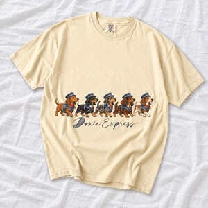Illustrated dachshunds in conductor hats lined up like a train, text Doxie Express