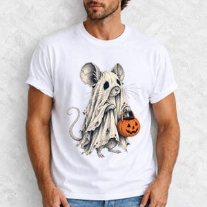 Etched pen illustration of a small mouse in a sheet ghost costume holding a candy bucket, bone white with orange accent
